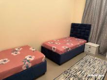 سرير للإيجار بغرفة للشباب العرب بالشارقة